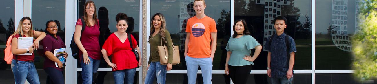 Current Students posing in front of the Campus Center